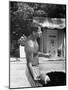 Attorney General Robert F. Kennedy Holding Football, with Dog Nearby, at His Swimming Pool-null-Mounted Photographic Print