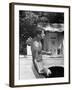 Attorney General Robert F. Kennedy Holding Football, with Dog Nearby, at His Swimming Pool-null-Framed Photographic Print