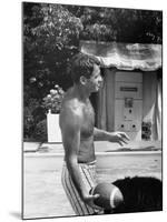 Attorney General Robert F. Kennedy Holding Football, with Dog Nearby, at His Swimming Pool-null-Mounted Photographic Print