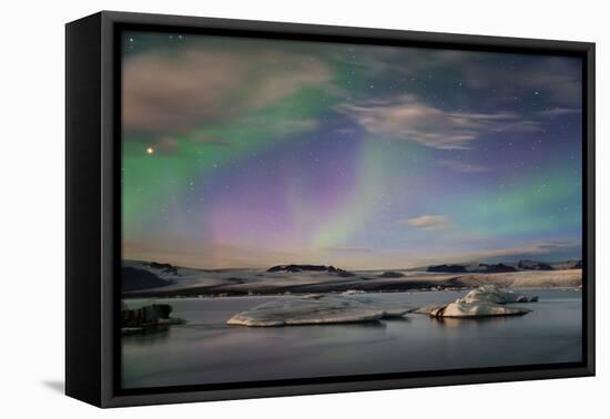 Aurora borealis (Northern Lights) over Jokulsarlon Glacial Lagoon, Iceland, Polar Regions-Miles Ertman-Framed Stretched Canvas