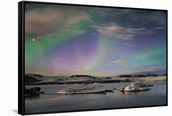 Aurora borealis (Northern Lights) over Jokulsarlon Glacial Lagoon, Iceland, Polar Regions-Miles Ertman-Framed Stretched Canvas