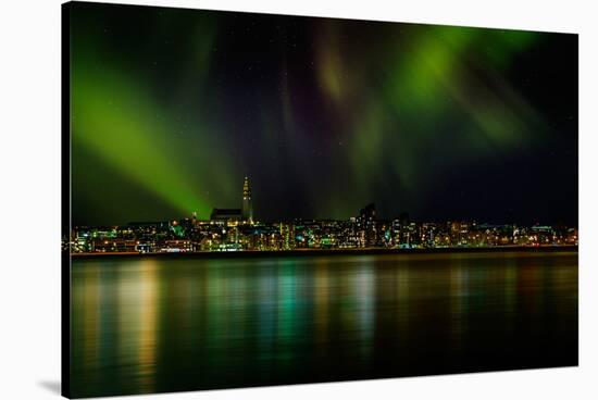 Aurora Borealis or Northern Lights over Reykjavik Skyline, Reykjavik, Iceland-null-Stretched Canvas