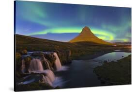 Aurora (Northern Lights) over a moonlit Kirkjufell Mountain, Snaefellsnes Peninsula, Iceland, Polar-Miles Ertman-Stretched Canvas