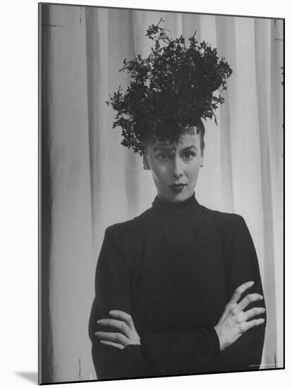 Austine Cassini Standing with Arms Crossed and Wearing Extravagant Hat-Marie Hansen-Mounted Premium Photographic Print