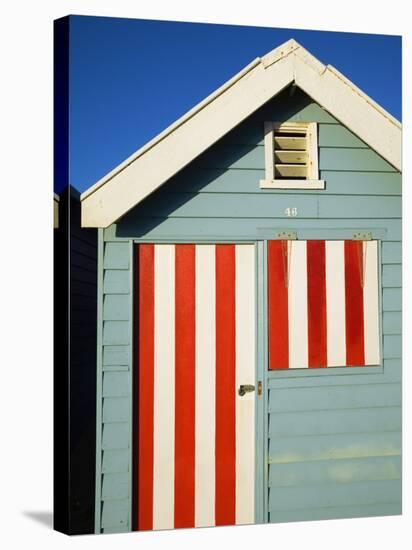 Australia, Victoria, Melbourne; Colourful Beach Hut at Brighton Beach-Andrew Watson-Stretched Canvas