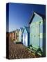 Australia, Victoria, Melbourne; Colourful Beach Huts at Brighton Beach-Andrew Watson-Stretched Canvas