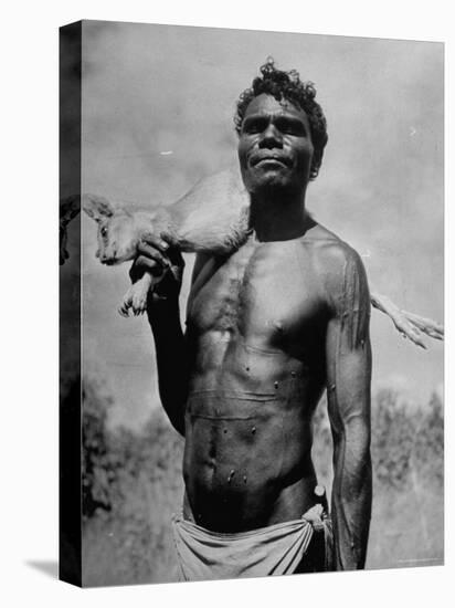 Australian Aborigine Holding a Freshly Killed Animal Used as a Food Source-Fritz Goro-Stretched Canvas