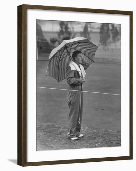 Australian Golfer Peter Thompson, Standing under Oversized Umbrella During the Los Angeles Open-Allan Grant-Framed Premium Photographic Print