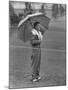 Australian Golfer Peter Thompson, Standing under Oversized Umbrella During the Los Angeles Open-Allan Grant-Mounted Premium Photographic Print