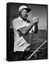 Author Ernest Hemingway at Wheel of Fishing Boat During Fishing Tournament-Alfred Eisenstaedt-Framed Stretched Canvas