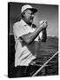 Author Ernest Hemingway at Wheel of Fishing Boat During Fishing Tournament-Alfred Eisenstaedt-Stretched Canvas