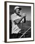 Author Ernest Hemingway at Wheel of Fishing Boat During Fishing Tournament-Alfred Eisenstaedt-Framed Premium Photographic Print