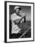 Author Ernest Hemingway at Wheel of Fishing Boat During Fishing Tournament-Alfred Eisenstaedt-Framed Premium Photographic Print