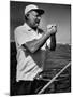 Author Ernest Hemingway at Wheel of Fishing Boat During Fishing Tournament-Alfred Eisenstaedt-Mounted Premium Photographic Print