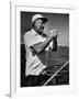 Author Ernest Hemingway at Wheel of Fishing Boat During Fishing Tournament-Alfred Eisenstaedt-Framed Premium Photographic Print