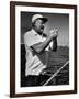 Author Ernest Hemingway at Wheel of Fishing Boat During Fishing Tournament-Alfred Eisenstaedt-Framed Premium Photographic Print