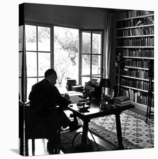 Author W. Somerset Maugham Sitting at Desk in the Study of His Villa Mauresque-null-Stretched Canvas