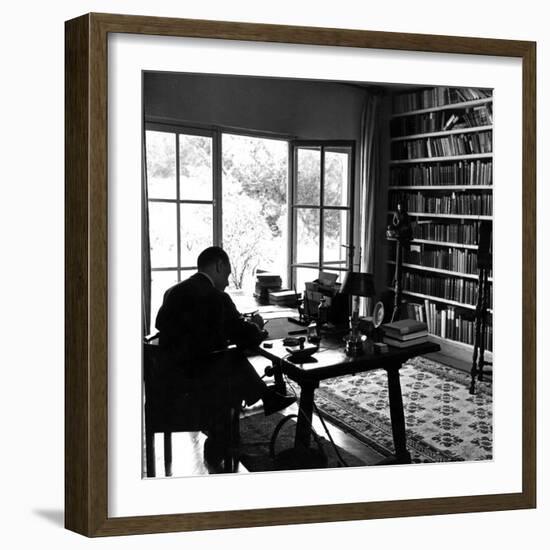 Author W. Somerset Maugham Sitting at Desk in the Study of His Villa Mauresque-null-Framed Premium Photographic Print