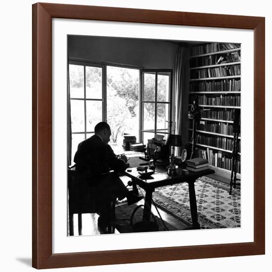 Author W. Somerset Maugham Sitting at Desk in the Study of His Villa Mauresque-null-Framed Premium Photographic Print