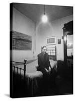 Author William Burroughs, an Ex Dope Addict, Relaxing on a Shabby Bed in a "Beat Hotel"-Loomis Dean-Stretched Canvas