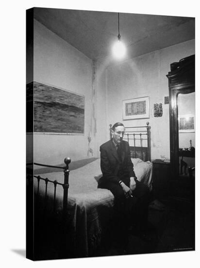 Author William Burroughs, an Ex Dope Addict, Relaxing on a Shabby Bed in a "Beat Hotel"-Loomis Dean-Stretched Canvas