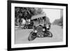 Automobile's Front Axel Breaks Splaying Tires Outward Causing Vehicle to Rest on its Front Bumper.-null-Framed Art Print