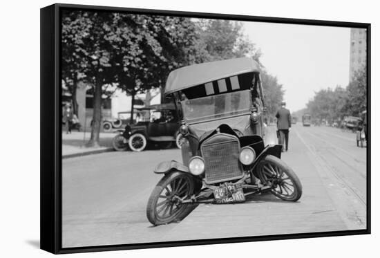 Automobile's Front Axel Breaks Splaying Tires Outward Causing Vehicle to Rest on its Front Bumper.-null-Framed Stretched Canvas