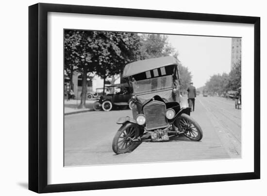 Automobile's Front Axel Breaks Splaying Tires Outward Causing Vehicle to Rest on its Front Bumper.-null-Framed Art Print