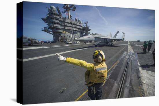 Aviation Boatswain's Mate Directs an F-A-18E Super Hornet-null-Stretched Canvas