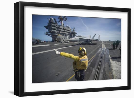 Aviation Boatswain's Mate Directs an F-A-18E Super Hornet-null-Framed Photographic Print