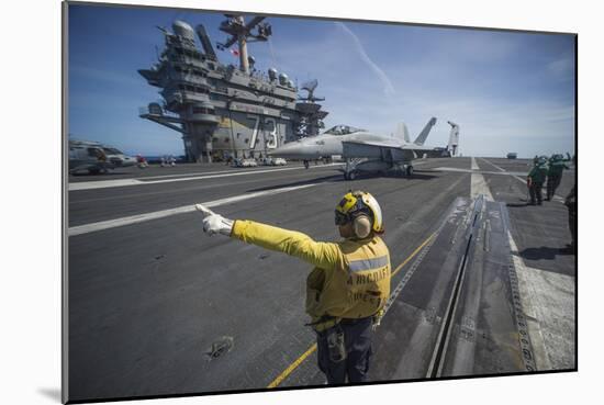 Aviation Boatswain's Mate Directs an F-A-18E Super Hornet-null-Mounted Photographic Print