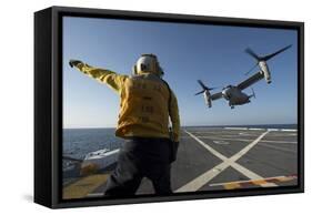 Aviation Boatswain's Mate Directs an MV-22 Osprey as it Launches from the Flight Deck-null-Framed Stretched Canvas