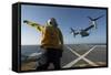 Aviation Boatswain's Mate Directs an MV-22 Osprey as it Launches from the Flight Deck-null-Framed Stretched Canvas