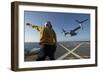 Aviation Boatswain's Mate Directs an MV-22 Osprey as it Launches from the Flight Deck-null-Framed Photographic Print