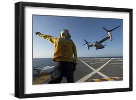 Aviation Boatswain's Mate Directs an MV-22 Osprey as it Launches from the Flight Deck-null-Framed Photographic Print