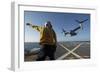 Aviation Boatswain's Mate Directs an MV-22 Osprey as it Launches from the Flight Deck-null-Framed Photographic Print