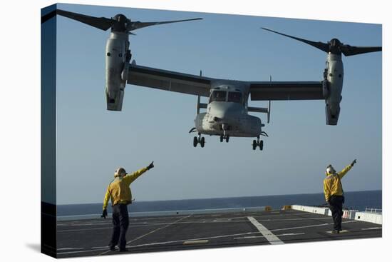 Aviation Boatswain's Mates Direct an MV-22 Osprey as it Launches from the Flight Deck-null-Stretched Canvas