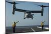 Aviation Boatswain's Mates Direct an MV-22 Osprey as it Launches from the Flight Deck-null-Mounted Photographic Print