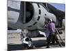 Aviation Fuel Technician Attaches a Fuel Line to an Av-8B Harrier-null-Mounted Photographic Print