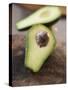 Avocado, Halved, on Old Chopping Board-Jo Kirchherr-Stretched Canvas