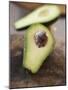 Avocado, Halved, on Old Chopping Board-Jo Kirchherr-Mounted Photographic Print