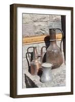 Azerbaijan, Lahic. A copper kettle and jug sitting outside a residence.-Alida Latham-Framed Photographic Print
