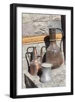 Azerbaijan, Lahic. A copper kettle and jug sitting outside a residence.-Alida Latham-Framed Photographic Print