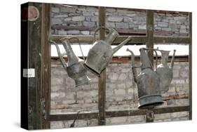 Azerbaijan, Lahic. Antique kettles hanging on the inside of a window.-Alida Latham-Stretched Canvas