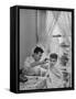 B.F. Goodrich Engineer Frank Herzegh Developed the Tubeless Tire, Cutting his son Frankie's hair-Alfred Eisenstaedt-Framed Stretched Canvas