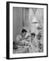 B.F. Goodrich Engineer Frank Herzegh Developed the Tubeless Tire, Cutting his son Frankie's hair-Alfred Eisenstaedt-Framed Photographic Print