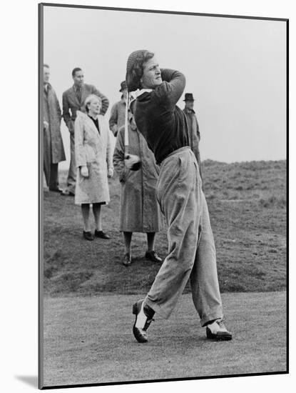 Babe Didrikson, Watching Golf Ball as She Completes Her Swing-null-Mounted Premium Photographic Print