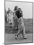 Babe Didrikson, Watching Golf Ball as She Completes Her Swing-null-Mounted Premium Photographic Print