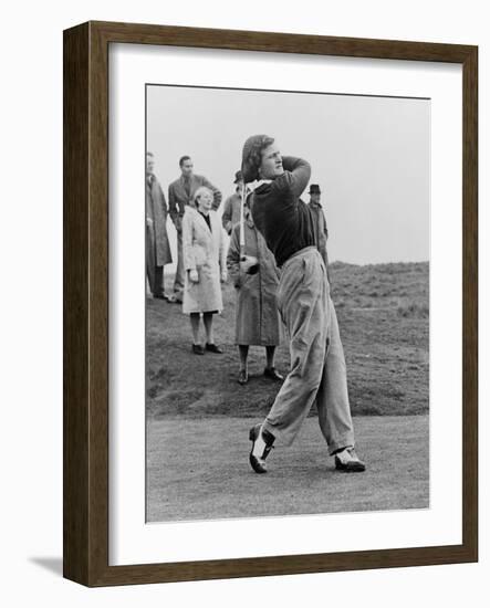 Babe Didrikson, Watching Golf Ball as She Completes Her Swing-null-Framed Photo