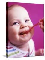 Baby Being Fed Baby Food-Alexandra Grablewski-Stretched Canvas